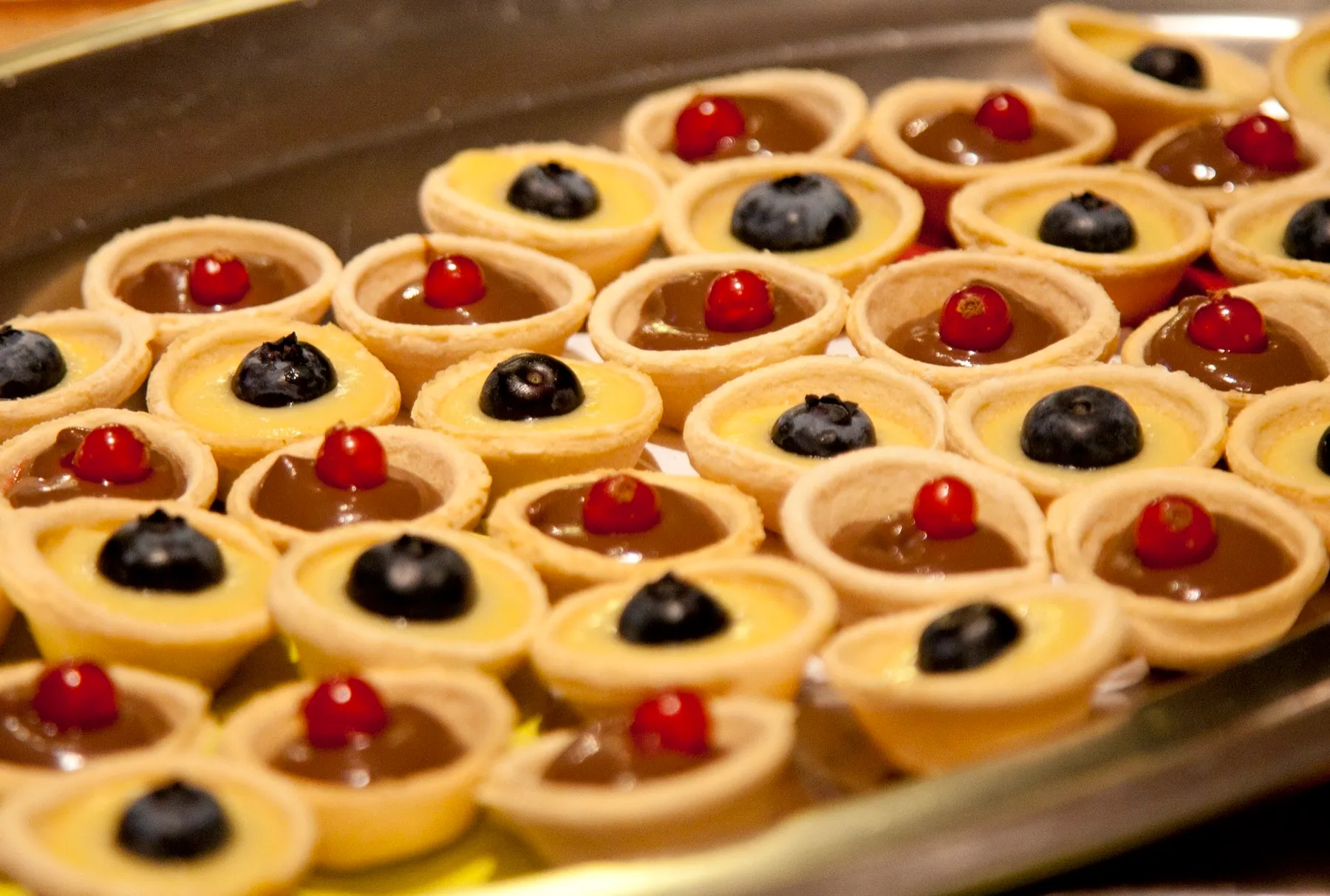 Petit fours with lemon, chocolate and blueberry